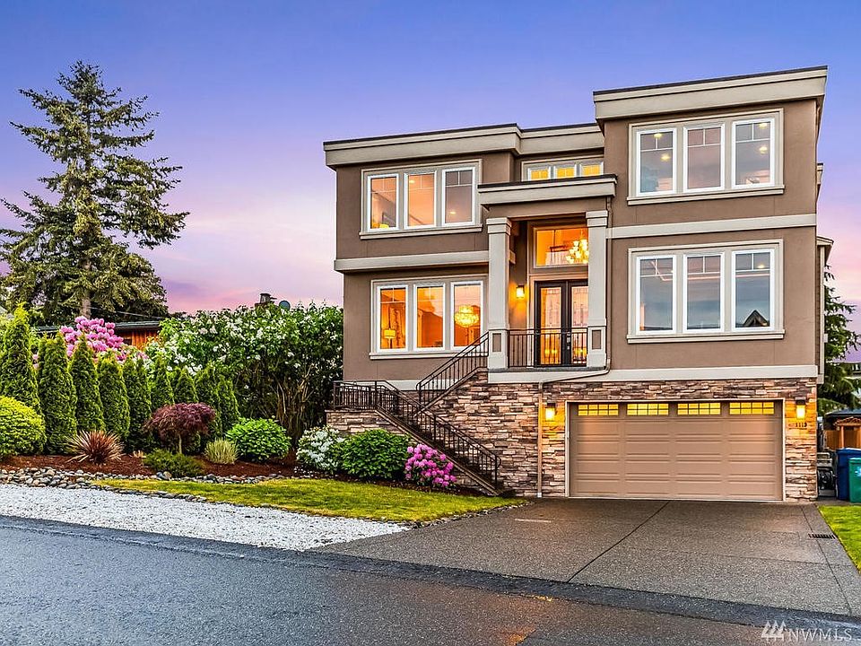 Luxurious custom home w/ sparkling Lake WA views, just 2 blocks from waterfront in Lower Kennydale. 