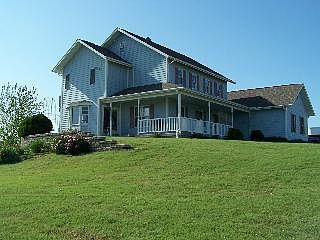 Wrap around porch with swing