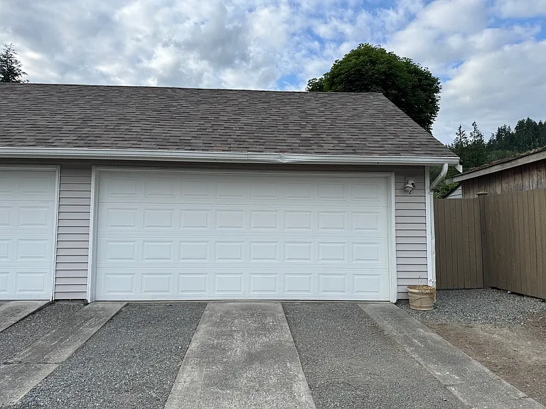 The back of the garage is fenced in