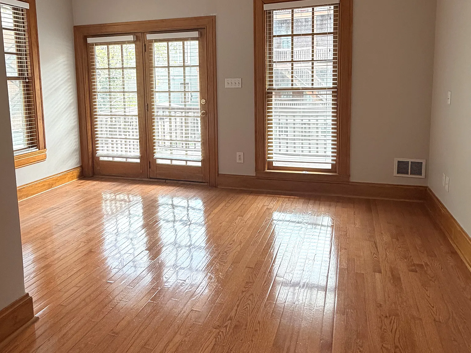 Main Bedroom: Spacious main bedroom featuring beautiful French doors that open directly onto the private balcony, bringing in abundant natural light and offering convenient outdoor access.