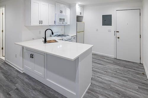 entry door into the apartment and kitchen area.