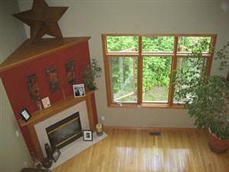 Light filled living room from loft above.