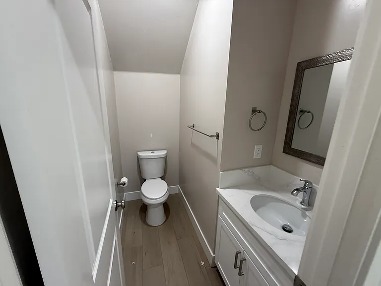half bath downstairs next to living room and kitchen