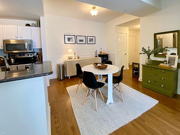 Kitchen and dining area. Unit includes a coat closet