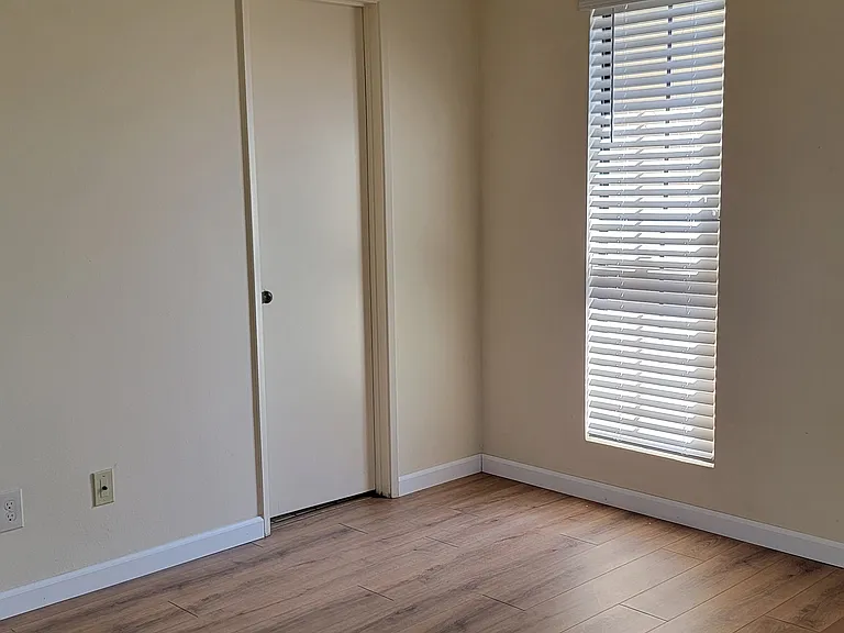 Unit F Master bedroom with door to bathroom