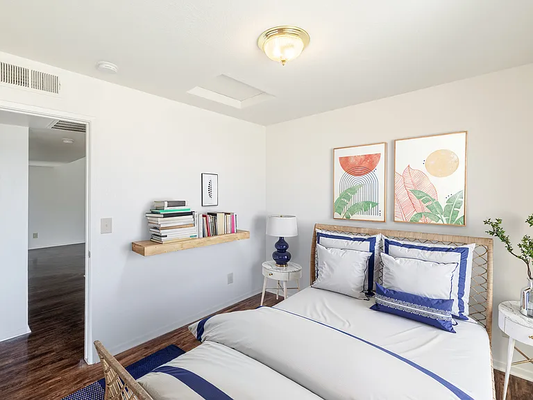 Bedroom #2 with spacious layout and ample room for furniture.
