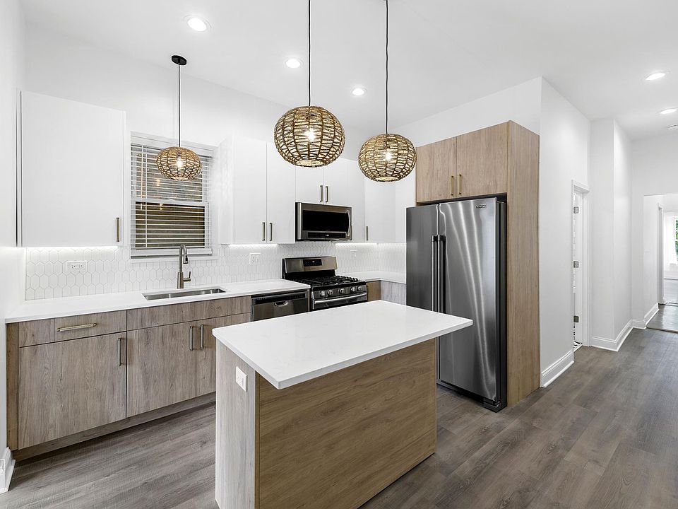 Renovated Kitchen with quartz countertops and stainless steel appliances