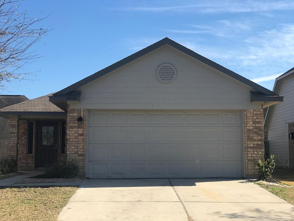 Front of the home with an attached double car garage. 