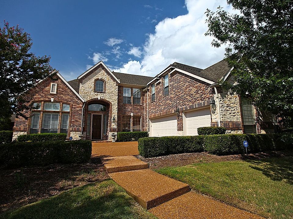 Front elevation sits on large lot.