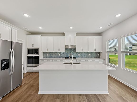 Kitchen in the Dakota floorplan at a Meritage Homes community in Garner, NC.