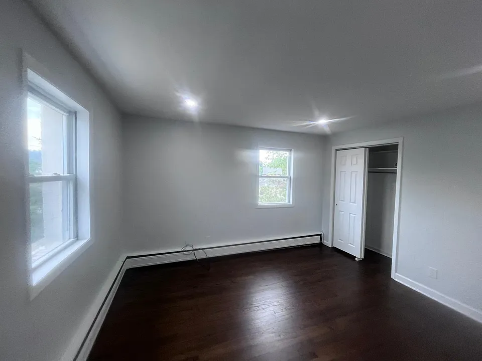 bed room one. lots of light, one closet, faces the street