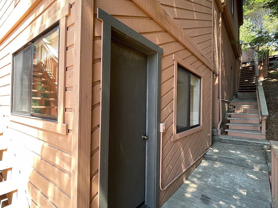 Private entry showing exterior walk down from street level parking.