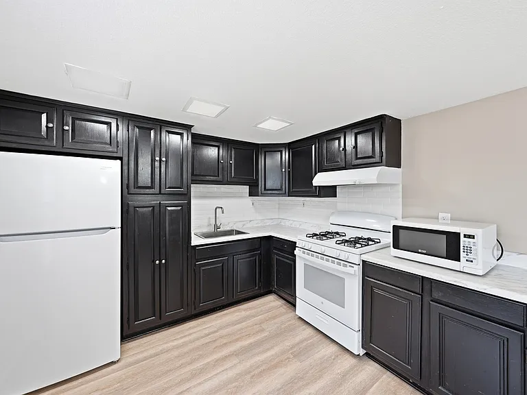 Kitchen with Natural Gas Range and Expansive Cabinetry