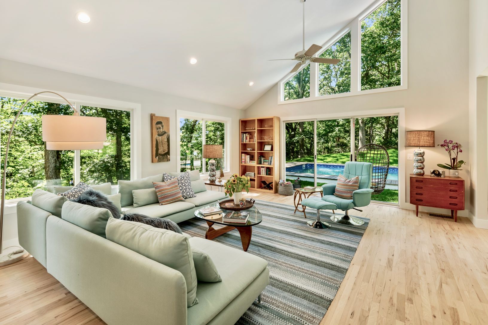  Hardwood floors and wall of windows that open to the pool.