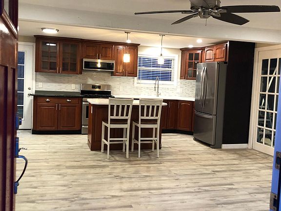 Kitchen with stainless steel appliances and island