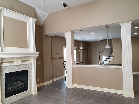 Great room with gas fireplace and built-in surround sound speakers