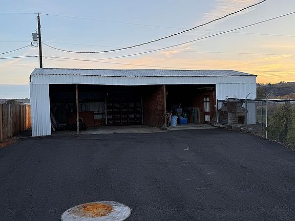Carport with storage unit