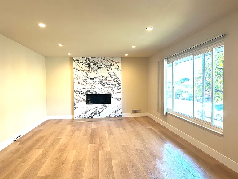 Living and dinning room combo, huge double layered window, view of front yard