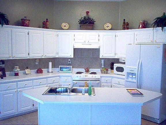 View into the kitchen..work island..Tile floors/backsplash..Double pantry