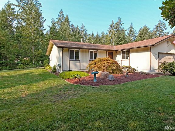 Enjoy 5 acres of secluded privacy, yet still conveniently located to all the shopping, ferries and freeways.