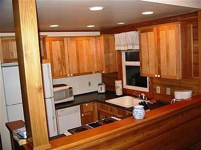 Kitchen area. Dishes, microwave, coffee maker-everything stays!