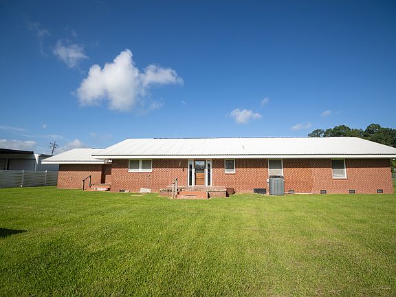 Back of home and expansive backyard. Almost 1/2 acre lot