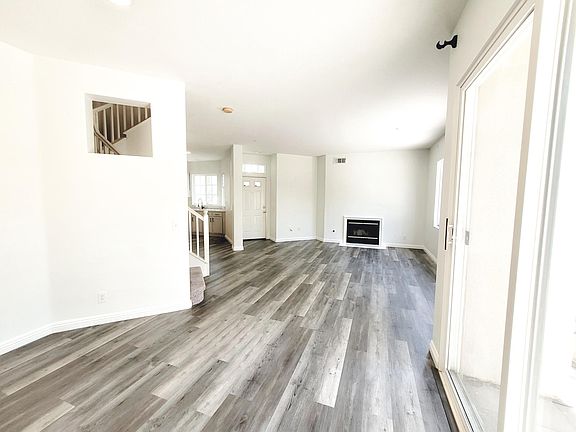Brand new vinyl flooring, new carpeted stairs, newly painted with grey dual layer roller shades