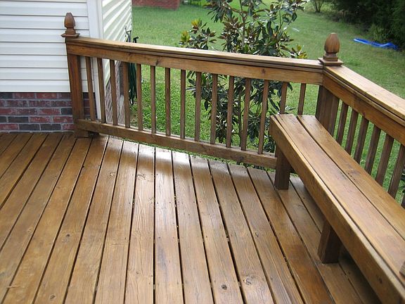 Newly stained deck with built in bench seat
