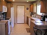 Kitchen has smooth-top range, built-in microwave, tons of cabinet space, break