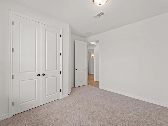 An additional view of the fifth bedroom with private bath perfect for an in-law suite or guest bedro