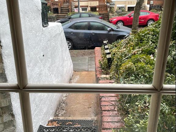 Entry walkway through living room windows