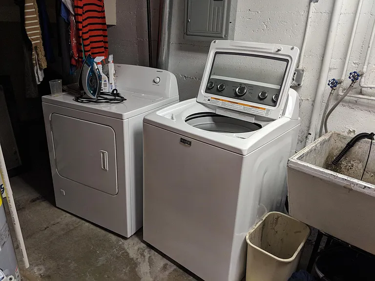 Full size washer and dryer in laundry room