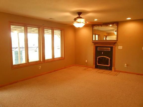 Family Room with the Buck stove inserted in the wall.