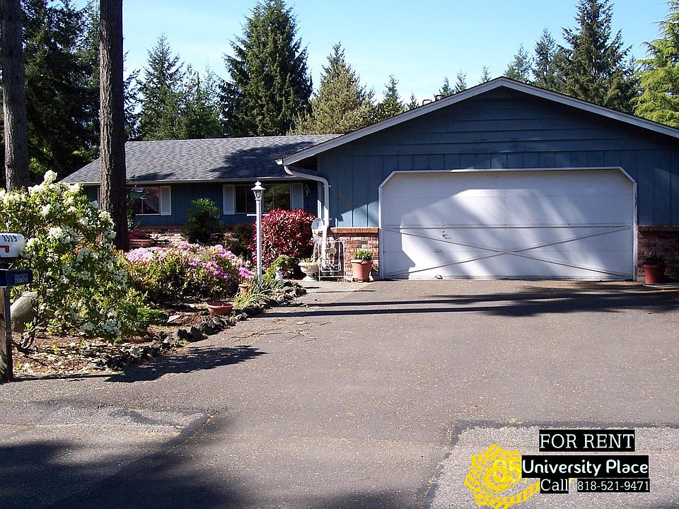 Beautiful front yard that has a park like feel!
