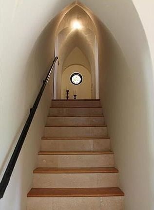 Gorgeous hardwood flooring on stairs leading to private guest su