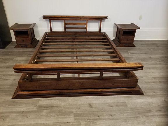 Queen size teak bed with end tables available for an extra fee.