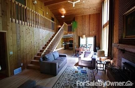 Great room with stairs
						:
						Great room with view to porch and kitchen.