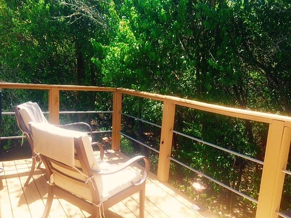 Oversized master deck overlooking the trees with the tranqui