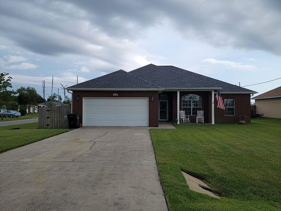 Home with brick facade and vinyl siding