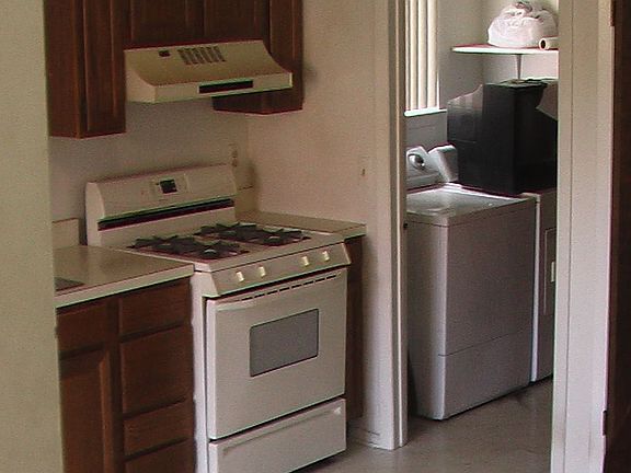kitchen w/ view of laundry room
