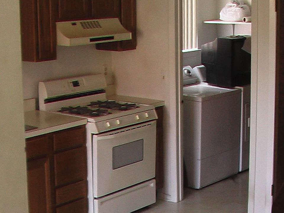 kitchen w/ view of laundry room