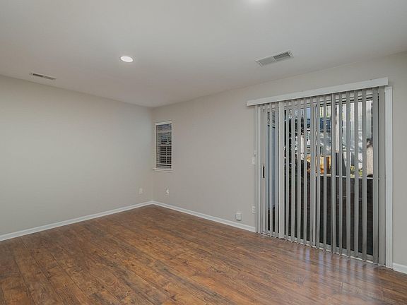 Open Concept Space with Sliding Glass Door to Patio