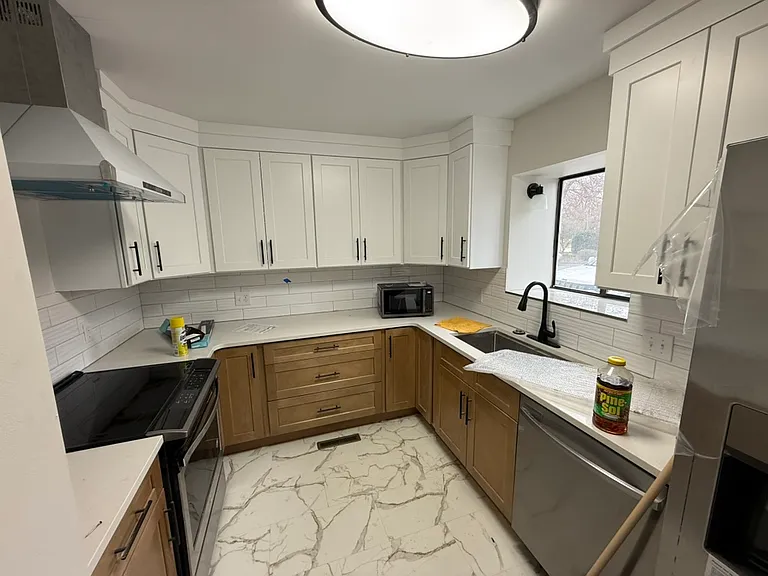 New cabinets, countertops and appliances in the kitchen.