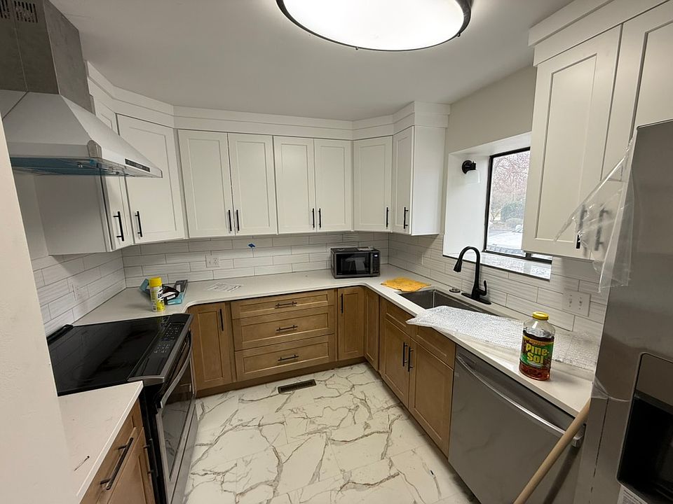 New cabinets, countertops and appliances in the kitchen.