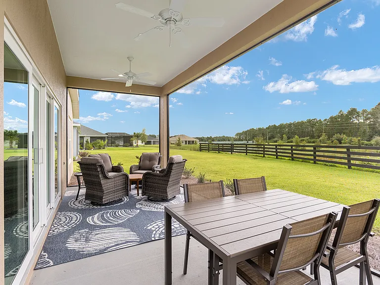 Screened in lanai with view of conservancy with view of water