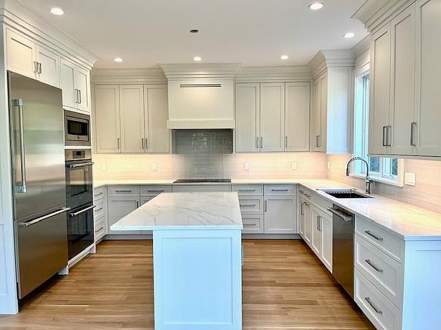 Gourmet Kitchen with Custom Cabinetry, Quartz Countertops, Thermador Appliances, Breakfast Island