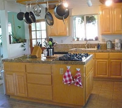 Large kitchen with maple cabinets and granite counters