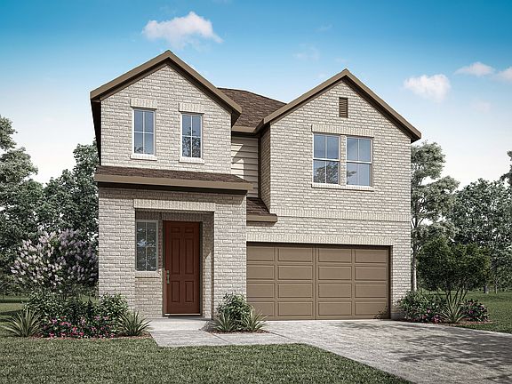 A two-story residential house with a garage, surrounded by trees and greenery, stands in a well-mani