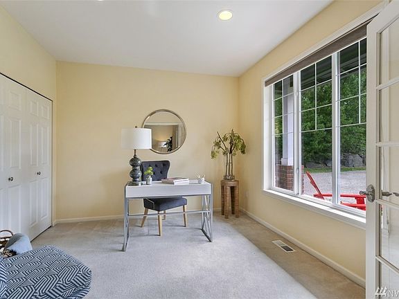 Private home office is just off of the foyer.  The private space could be used as an office or a downstairs bedroom, making it the 5th bedroom in the home! 