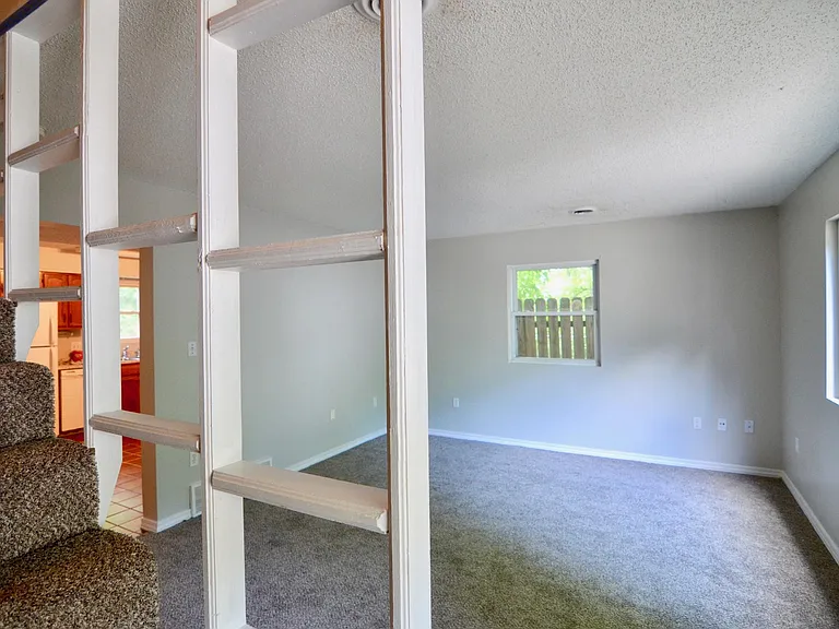 inside of next door unit, unit C has mirrored floor plan, carpet wall color cabinet color may differ